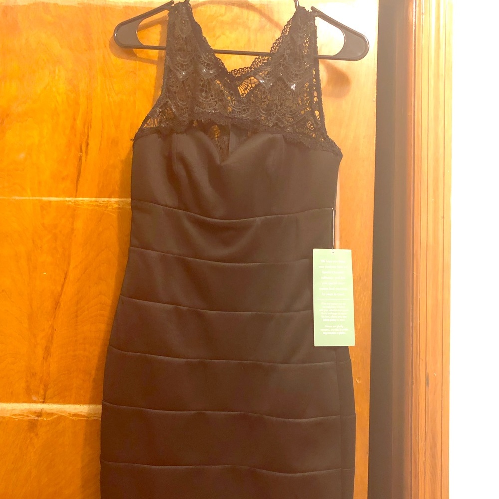 Black  dress top is lace size 9